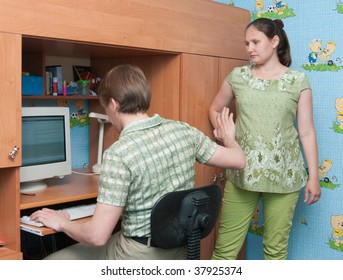 The Conflict In A Family: The Husband Plays The Computer And Does Not Pay Attention To A Family