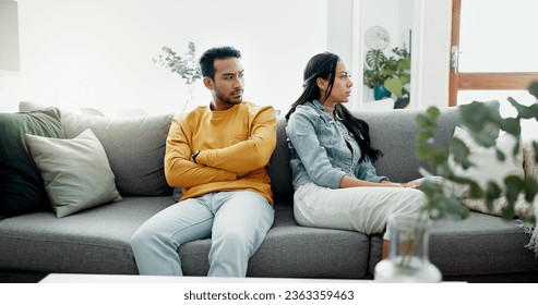 Conflict, fight and couple angry on a couch together duo to infertility, argument and toxic relationship in a home. Unhappy, divorce and man has problem with woman in a living room sofa for cheating - Shutterstock ID 2363359463