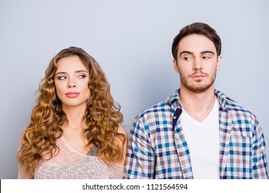 Conflict Insult Disagreement Distrust Fight Cheat Quarrel Crisis Concept. Portrait Of Modern Couple In Casual Outfits Looking At Each Other With Eyes Isolated On Grey Background