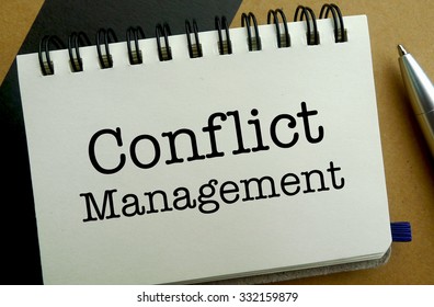 Conflict Management Memo Written On A Notebook With Pen