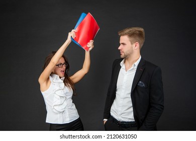 Conflict In The Professional Workplace. Aggressive Woman Hit Man With Books. Conflict Management