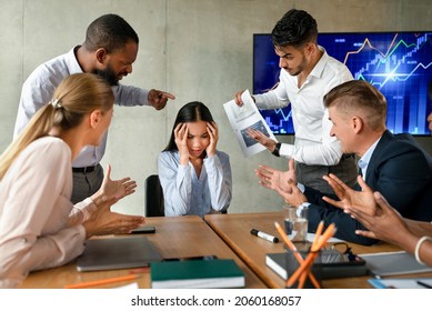 Conflicts At Work. Unhappy Asian Female Employee Suffering From Mobbing And Bullying In Office, Upset Employee Lady Covering Ears While Aggressive Coworkers Shouting At Her During Corporate Meeting - Shutterstock ID 2060168057