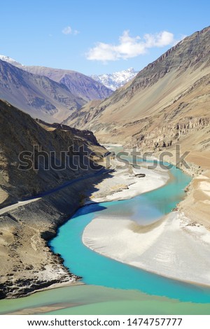 Confluence of the Indus and Zanskar Rivers are two different colors of water , between Kargil and leh,India.River in Leh Ladakh, India. 2 Rivers, Indus and Zanskar River .