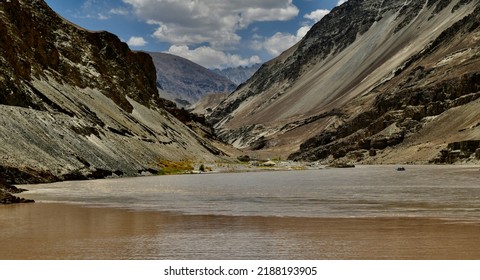 Confluence Of River Indus And Zanskar In Leh. The Different Colour Of The Water Of Both The Rivers Can Be Made Out In The Beautiful Brown Valley