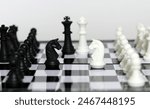 The confrontation between a chess black horse and a white horse. Chess pieces in chess board games for challenges, leadership, strategy, business, success, or abstract concepts.