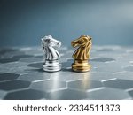 The confrontation between golden and silver horses, knight chess piece standing together on hexagon pattern background. Leadership, partnership, competitor, competition, and business strategy concept.