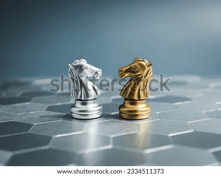The confrontation between golden and silver horses, knight chess piece standing together on hexagon pattern background. Leadership, partnership, competitor, competition, and business strategy concept.