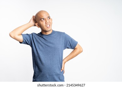 Confused Asian Bald Man Holding His Bald Head