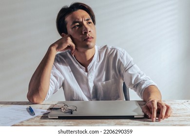 Confused Asian Man Overthinking Sitting Alone Stock Photo 2206290359 ...