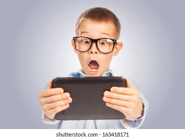 confused boy with tablet