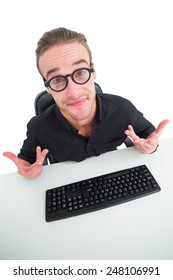 Confused businessman with glasses at desk on whit ebackground