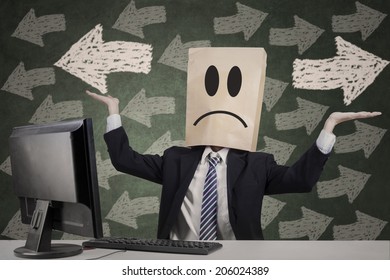 Confused Businessman With Paper Head Gesturing Confuse