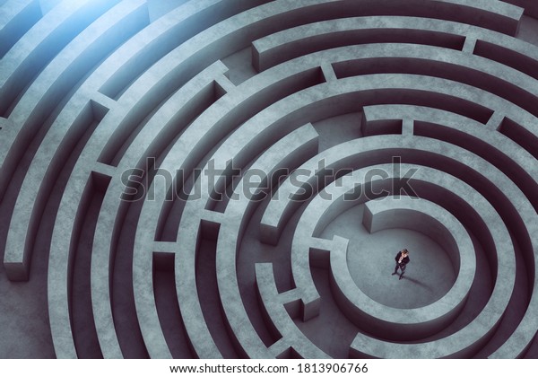 Confused businessman thinks how to find the right
way to exit from a big
maze