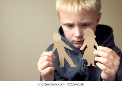 Confused Child With Cutting Paper Parents, Family Problems, Divorce, Custody Battle, Suffer Concept 