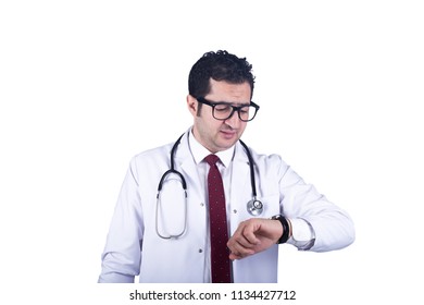 Confused Doctor Looks At His Wrist Watch Missed His Appointment Annoyed Isolated On A White Background.