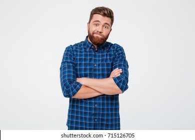 Confused Frustrated Bearded Man Standing With Arms Folded Isolated Over White Background