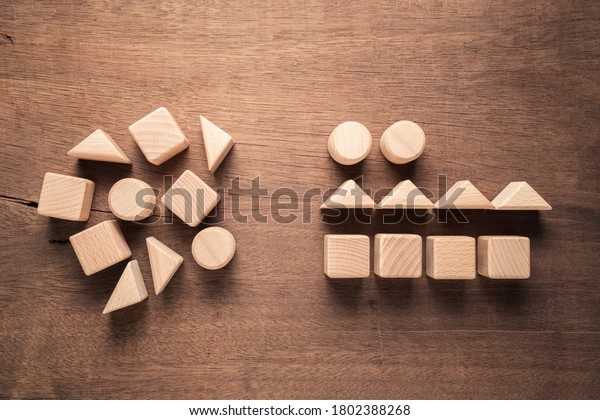 Confused geometry\
shape of wood blocks on the left rearrange in the same category on\
the right, category\
concept
