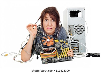 confused and grimacing woman shown computer motherboard