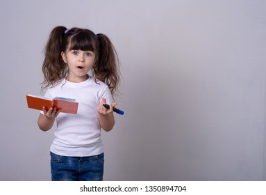 Confused Kid. Young Girl Having Doubts While Raising Hands. Not Sure.