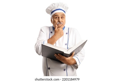 Confused Male Chef Holding A Cook Book Isolated On White Background