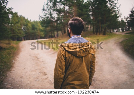 confused man chooses road outdoor 