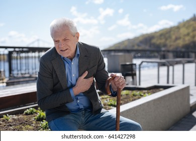 Confused Man Feeling Heart Attack On The Quay