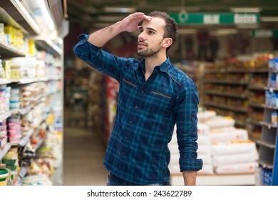 Confused Man Shopping At The Supermarket