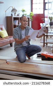 Confused Person While Assembling New Furniture At Home