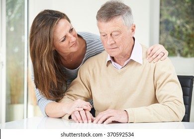 Confused Senior Man With Adult Daughter At Home