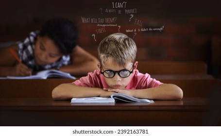 Confused and struggling to learn - Learning disabilities. Young boy feeling overcome with boredom in the classroom.
