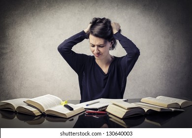 Confused Student With Hands In The Hair