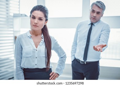 Confused Superior. Unpleasant Boss Failing In Understanding Problem With His Female Colleague