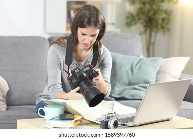 Confused Tourist Trying To Set A Complicated Dslr Camera Sitting On A Couch In The Living Room At Home