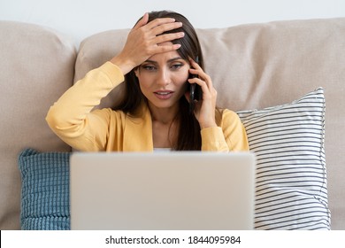 Confused Woman Doing Facepalm Gesture, Touching Head With Palm, Looking At Screen While Working On Laptop, Sent Email To The Wrong Address, Talking On Mobile Phone. Epic Fail, Reaction Concept