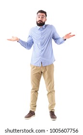 Confused Young Bearded Businessman Shrugging Shoulders Looking At Camera. Full Body Length Portrait Isolated On White Studio Background.