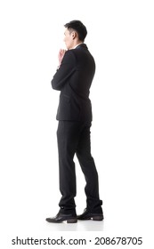 Confused Young Business Man Standing And Thinking, Full Length Portrait Isolated On White Background.