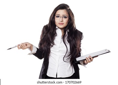 Confused Young Business Woman Posing With A Clipboard In Her Hand