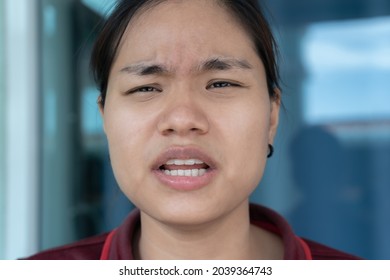 Confused young girl expressing distrust and suspicion, doubt and confusion concept. Woman with disgruntled face, complaining and arguing, talking troubled uneasy, stare camera angry. Human emotion - Shutterstock ID 2039364743
