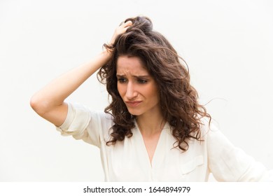 Confused Young Woman Rubbing Hair Upset Stock Photo 1644894979 ...