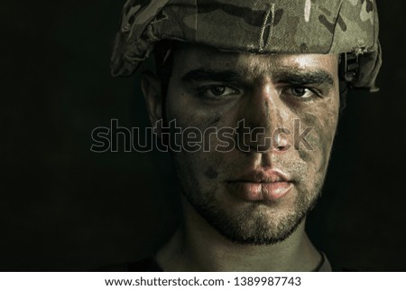 Confusing in himself. Close up portrait of young male soldier. Man in military uniform on the war. Depressed and having problems with mental health and emotions, PTSD, rehabilitation.