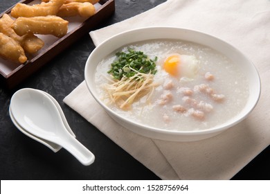 Congee with minced pork and egg is a favorite breakfast for south east asian people.