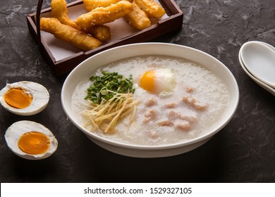 Congee with minced pork and egg is a favorite breakfast for south east asian people. 