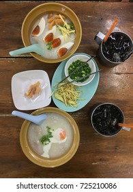 Congee with preserved eggs and bolied egg as a breakfast, top view.