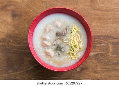 Congee, Rice Porridge, Rice Gruel, Rice Soup On Wooden Background, Top View.