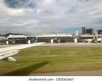 Congonhas, Sao Paulo, Brazil - February 25, 2019: Boarding And Disembarkation Of Passengers At São Paulo Airport, Modern Architecture, On The Left Side Of The Image, On The Wing Of An Airplane.