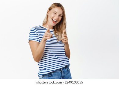 Congrats, you got this, nice job. Smiling happy blond woman pointing fingers at camera, choosing you, congratulating winner, inviting people to event, white background - Shutterstock ID 2249138055