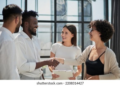 Congratulating the new partners in modern office - Shutterstock ID 2208314427