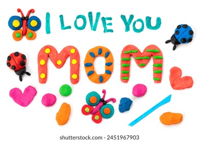 Congratulations from a child on Mother's Day. Bright hand drawn childish card with crafted plasticine colorful mom lettering, butterfly. Flat lay children's creative handmade multicolor Modeling Clay - Powered by Shutterstock