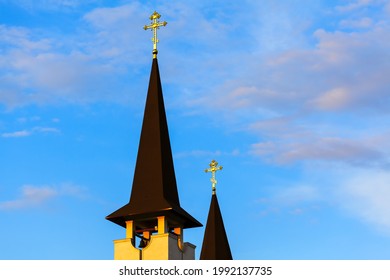 Conical Church Spire With Golden Cross On The Top . Religious Architecture 