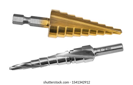 Conical step drill bits isolated on white background. Two steel unibits. Golden with titanium coating and straight flute or silvery with screw groove. Drilling of a varied hole sizes. Chip machining.